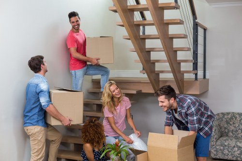 Moving van and packed boxes outside a Barnescray home