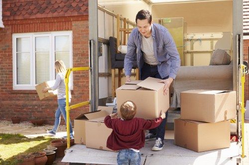 Packed boxes and furniture ready for a removal van