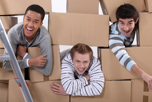 Team loading items safely into a moving van