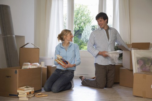 Careful unpacking of kitchen items in a Barnescray property