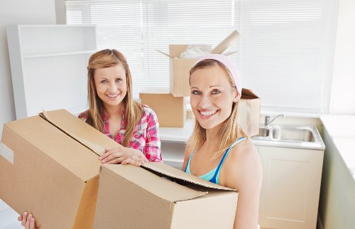 Packed boxes and furniture ready for removal service collection