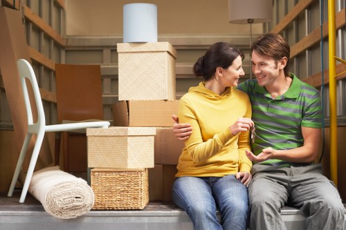 Packed moving boxes and furniture ready for transport